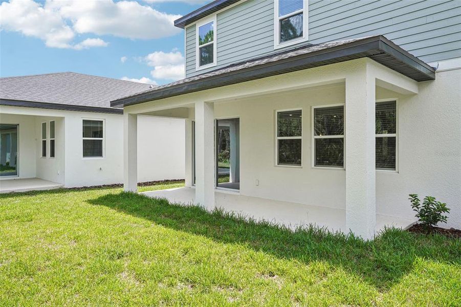 Exterior details and patio area of a home in Ridgehaven - Signature Series, Ormond Beach (Image 3).
