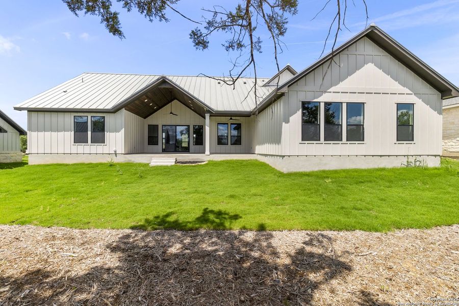 Front exterior of a new home in , Wimberley, TX, highlighting curb appeal (Image 10).