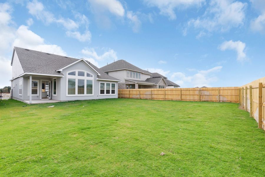 Exterior details and patio area of a home in Santa Rita Ranch, Liberty Hill (Image 15). Exterior details and patio area of a home in Santa Rita Ranch, Liberty Hill (Image 15).