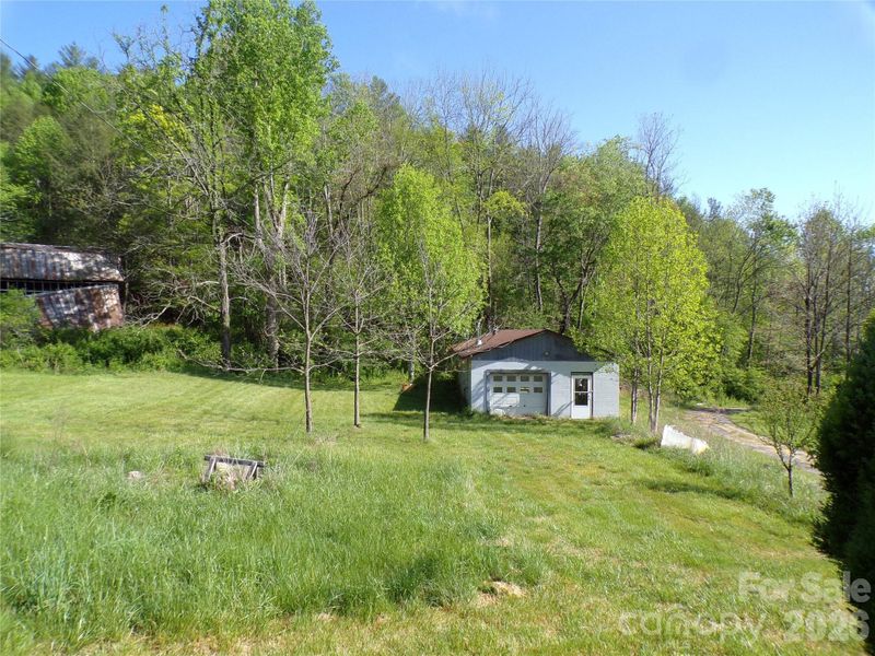 Side yard view with tandem garage/workshop