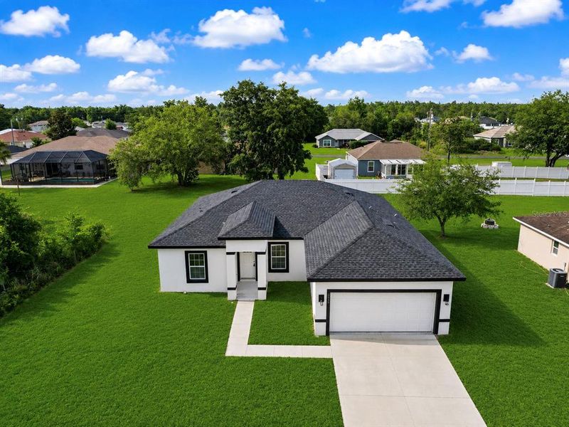 Front exterior of a new home in , Ocala, FL, highlighting curb appeal (Image 24).