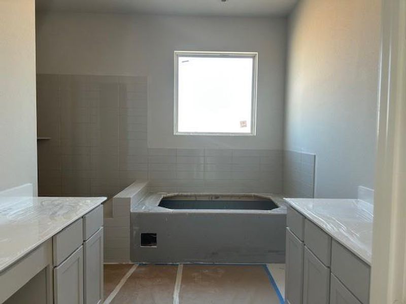 Primary Bathroom with a luxurious garden tub and spacious shower