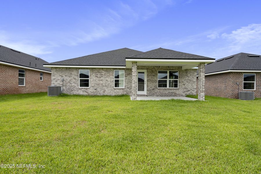Front exterior of a new home in Shadow Crest at Rolling Hills, Green Cove Springs, FL, highlighting curb appeal (Image 13).