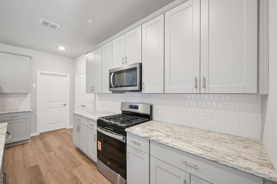 Photo is not of the actual home, but is an inspirational photo of builder’s model home and may depict options, furnishings, and/or decorator features that are not included.