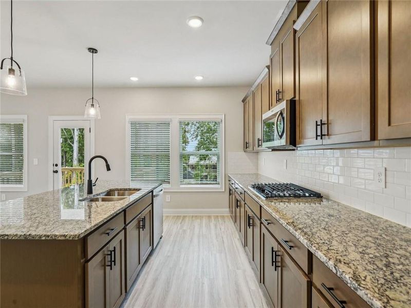 Furnished interior view inside a new home in Martin Springs - Estate Series, Lawrenceville (Image 6).
