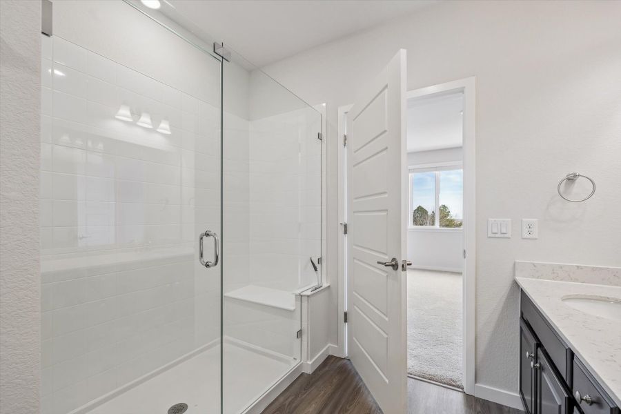A bathroom with a glass shower.