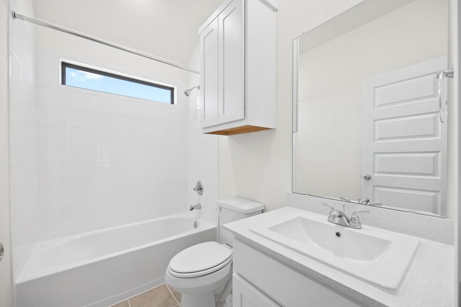 Bathroom in the Cypress home plan by Trophy Signature Homes - REPRESENTATIVE PHOTO
