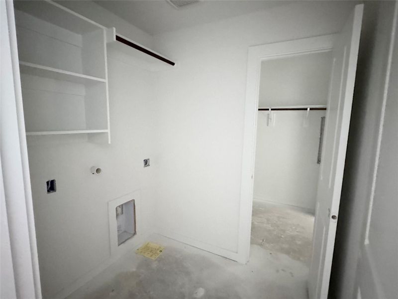 Washroom featuring unfinished concrete floors