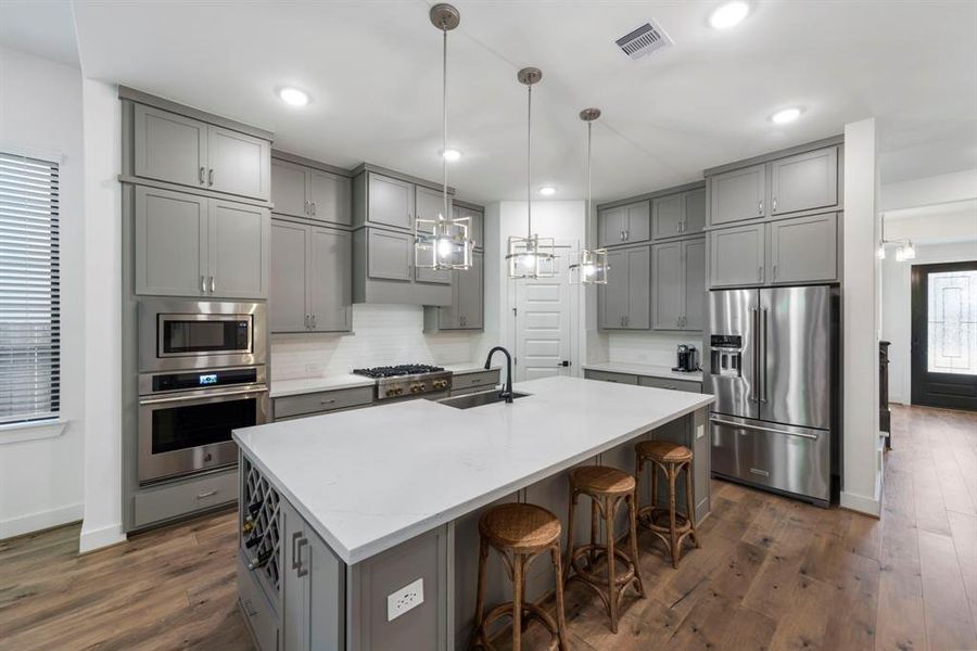 Enjoy convenient features such as wine storage, as well as soft-close cabinets and drawers, adding both sophistication and functionality to the kitchen.