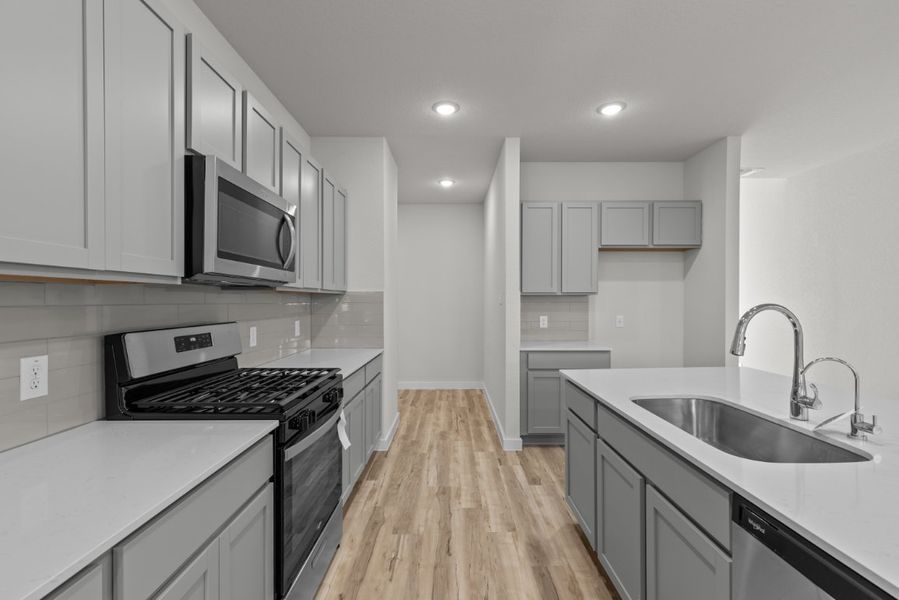 A kitchen with white cabinets. A kitchen with white cabinets.