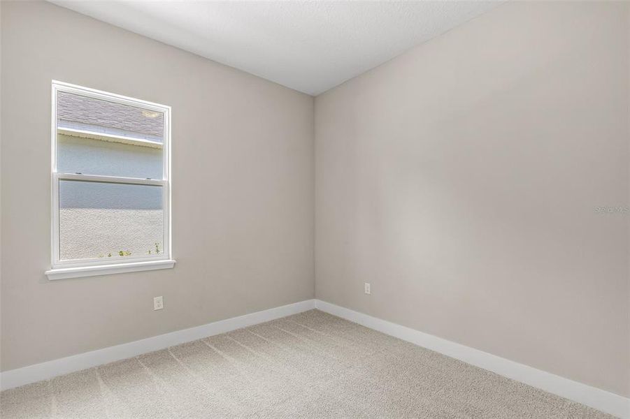 Spacious, unfurnished interior of a new home in Gray Hawk at Hole Two, Daytona Beach (Image 20).