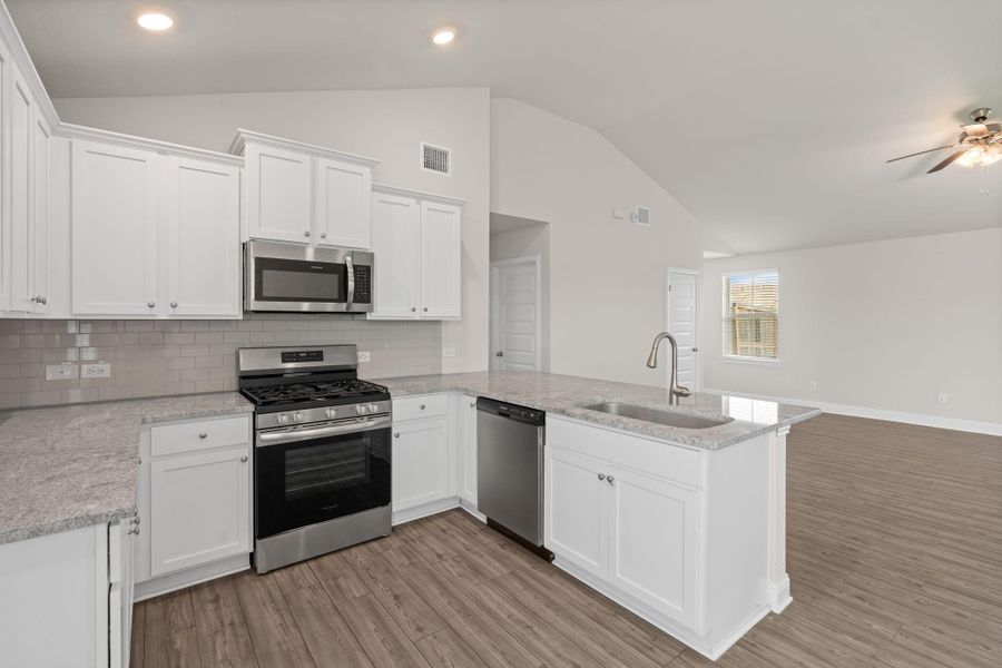 Furnished interior view inside a new home in Sunterra, Katy (Image 7).