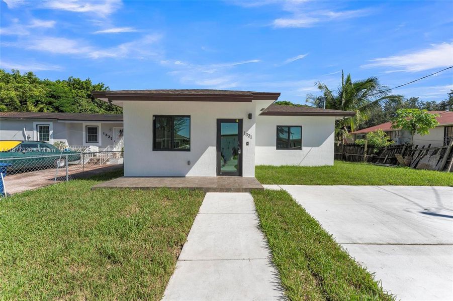 Front exterior of a new home in , Miami, FL, highlighting curb appeal (Image 17).