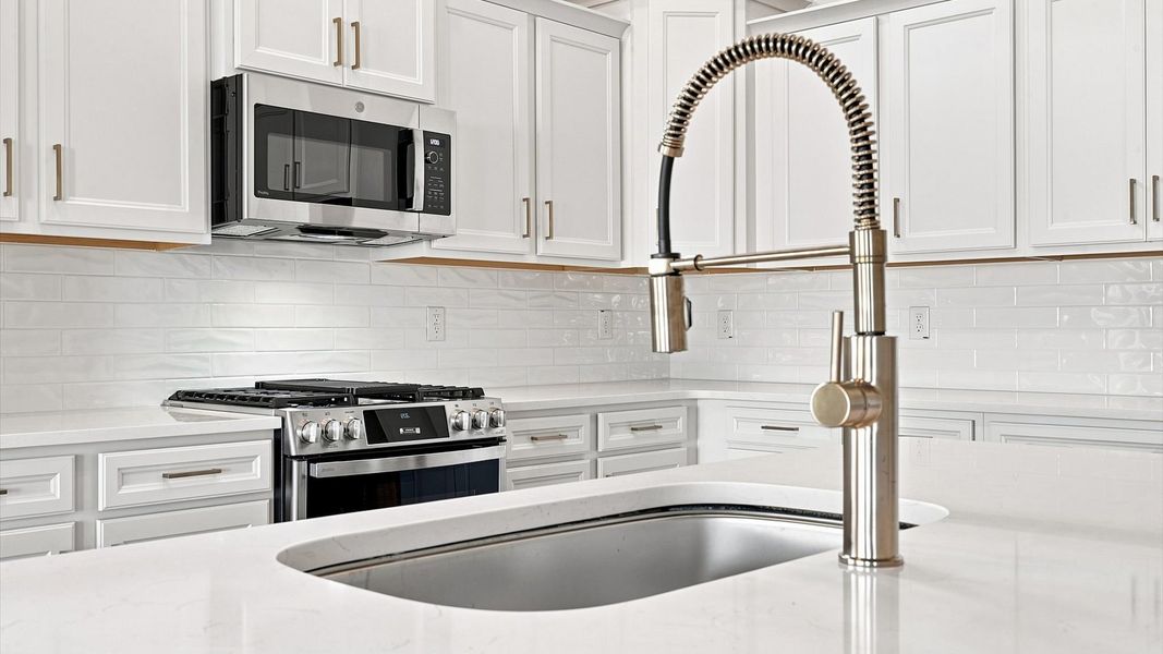 Exclusive kitchen design with large island and tasteful finishes throughout Exclusive kitchen design with large island and tasteful finishes throughout