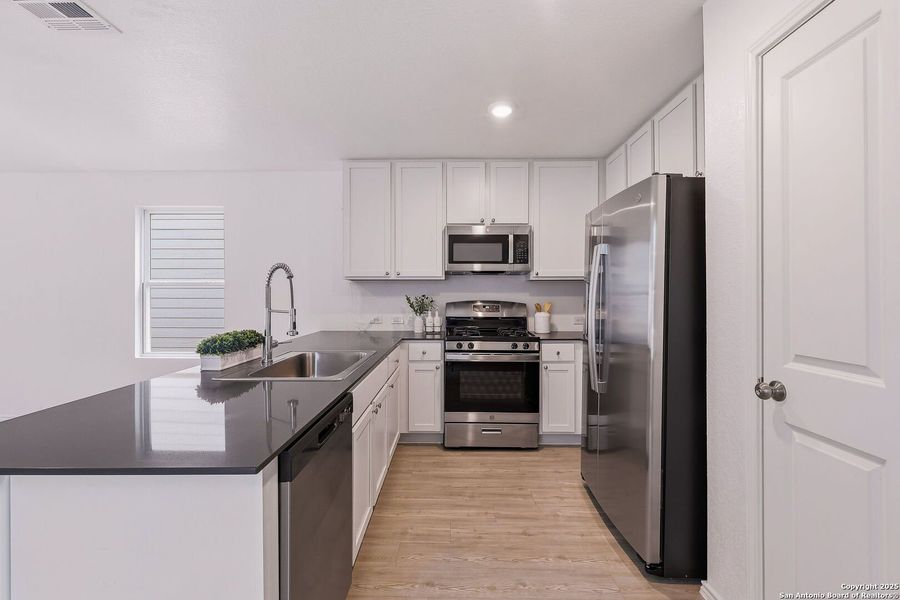Furnished interior view inside a new home in Aston Park: Wellton Collection, San Antonio (Image 9).