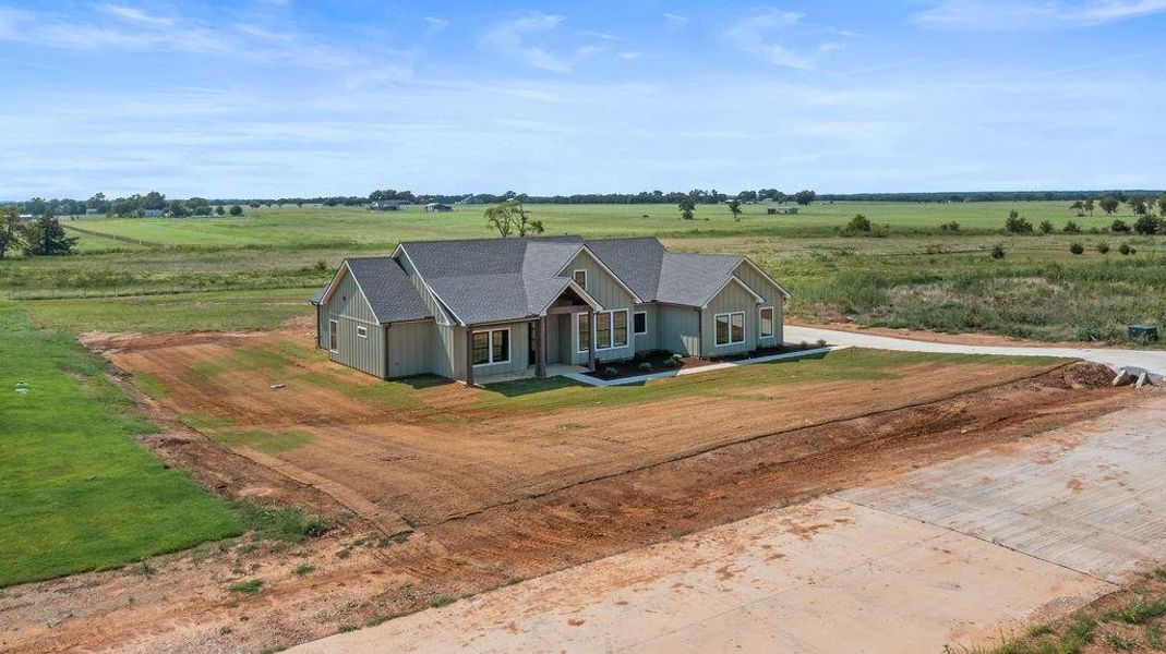 Front exterior of a new home in , Whitesboro, TX, highlighting curb appeal (Image 21).