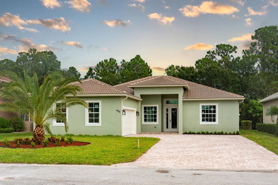 Front exterior of a new home in , Port St. Lucie, FL, highlighting curb appeal (Image 1).