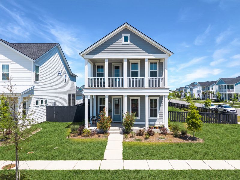 Front exterior of a new home in Carnes Crossroads, Summerville, SC, highlighting curb appeal (Image 1). Front exterior of a new home in Carnes Crossroads, Summerville, SC, highlighting curb appeal (Image 1).