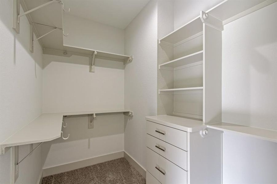 His and hers primary closet with lots of storage.