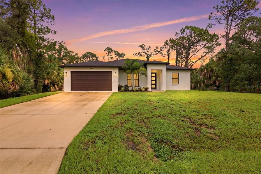 Front exterior of a new home in , Port Charlotte, FL, highlighting curb appeal (Image 21).