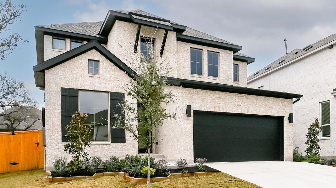 Front exterior of a new home in 6 Creeks, Kyle, TX, highlighting curb appeal (Image 23).