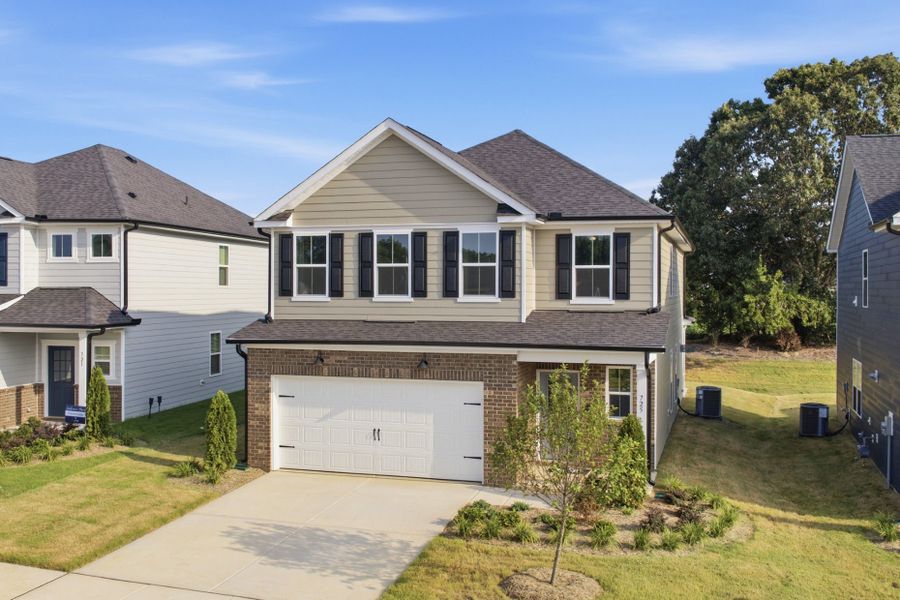 Front exterior of a new home in Providence Oaks, Fuquay Varina, NC, highlighting curb appeal (Image 28). Front exterior of a new home in Providence Oaks, Fuquay Varina, NC, highlighting curb appeal (Image 28).