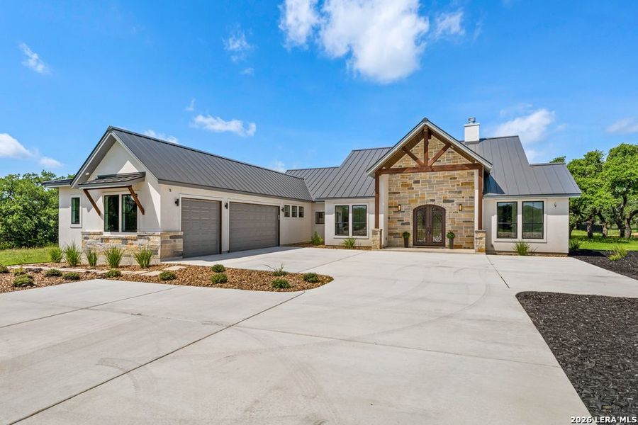 Front exterior of a new home in , Bulverde, TX, highlighting curb appeal (Image 2). Front exterior of a new home in , Bulverde, TX, highlighting curb appeal (Image 2).