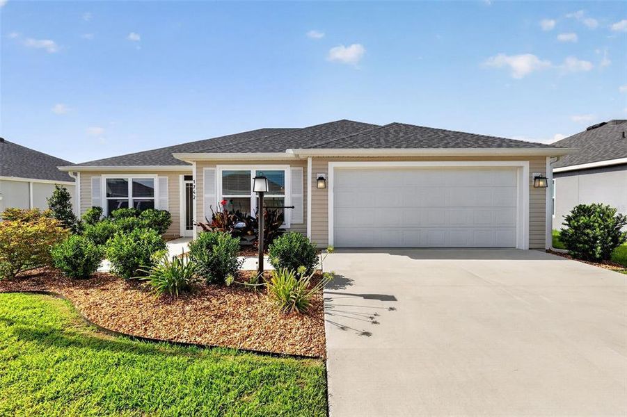 Front exterior of a new home in , The Villages, FL, highlighting curb appeal (Image 1). Front exterior of a new home in , The Villages, FL, highlighting curb appeal (Image 1).
