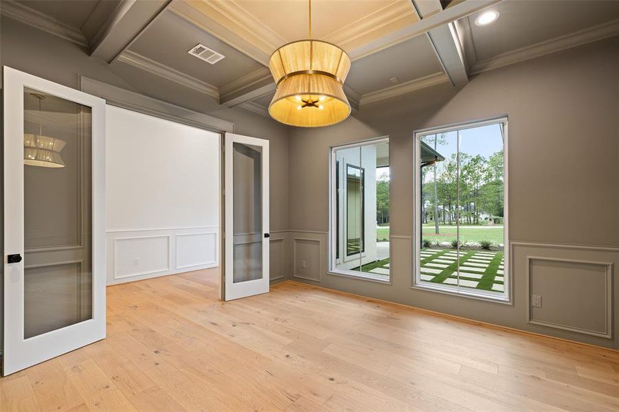 The office space overlooks the front courtyard and has a coffered ceiling!