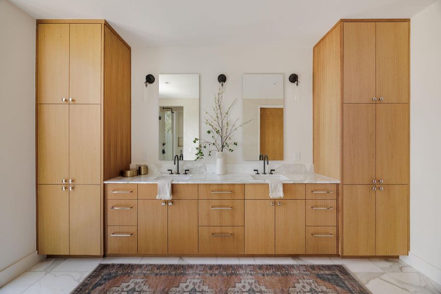 Bathroom with marble finish floors and double vanity Bathroom with marble finish floors and double vanity