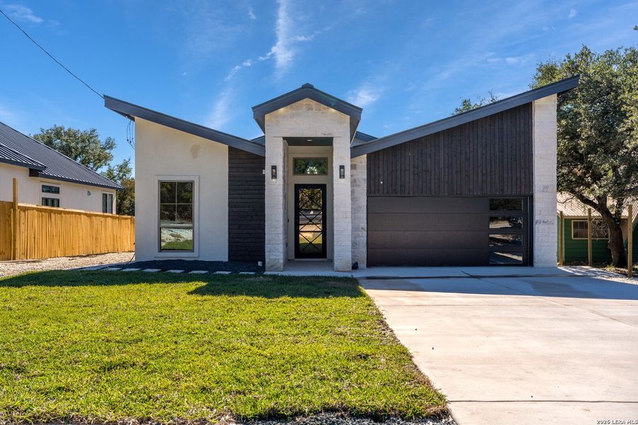Front exterior of a new home in , Spring Branch, TX, highlighting curb appeal (Image 19). Front exterior of a new home in , Spring Branch, TX, highlighting curb appeal (Image 19).