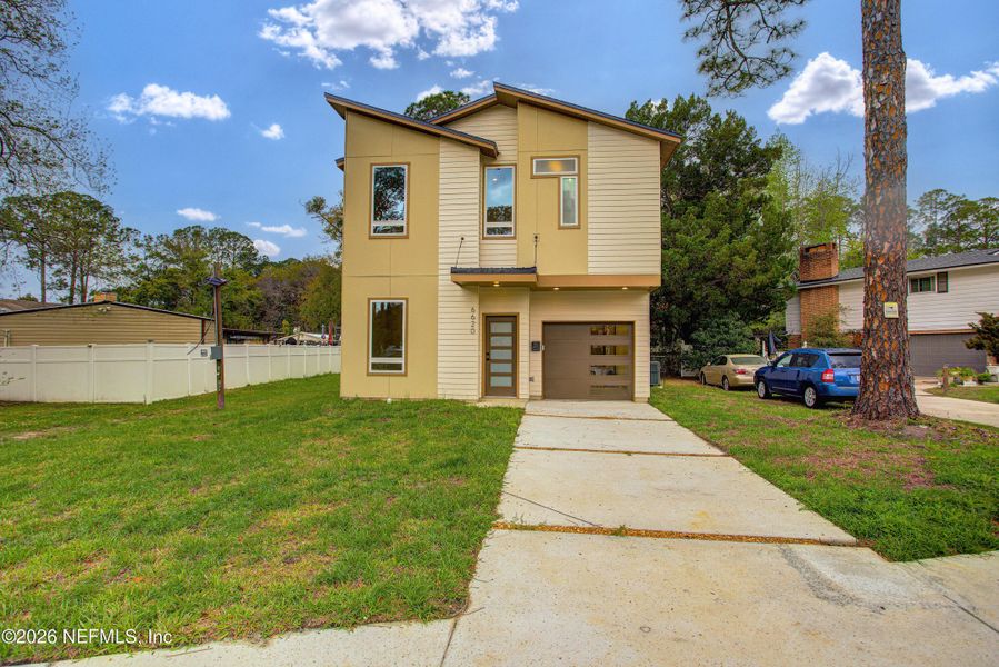 Front exterior of a new home in , Jacksonville, FL, highlighting curb appeal (Image 1). Front exterior of a new home in , Jacksonville, FL, highlighting curb appeal (Image 1).