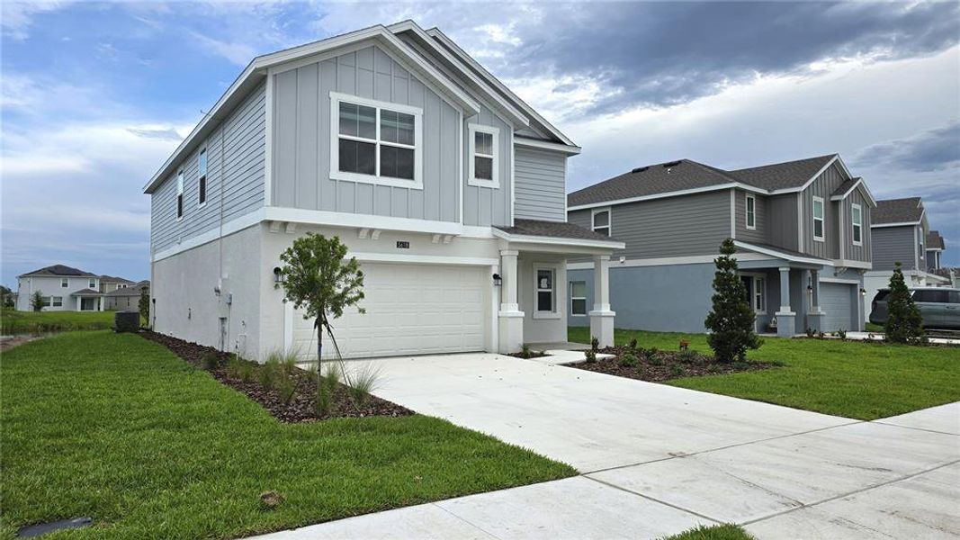 Front exterior of a new home in Westview, Kissimmee, FL, highlighting curb appeal (Image 2). Front exterior of a new home in Westview, Kissimmee, FL, highlighting curb appeal (Image 2).