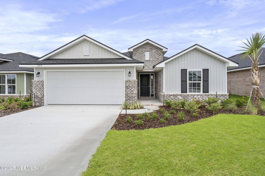 Front exterior of a new home in Shadow Crest at Rolling Hills, Green Cove Springs, FL, highlighting curb appeal (Image 1). Front exterior of a new home in Shadow Crest at Rolling Hills, Green Cove Springs, FL, highlighting curb appeal (Image 1).