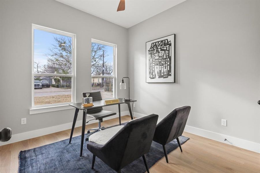 Office featuring ceiling fan and light hardwood / wood-style flooring