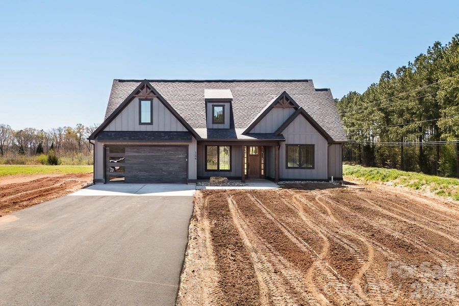 Front exterior of a new home in , Norwood, NC, highlighting curb appeal (Image 5).