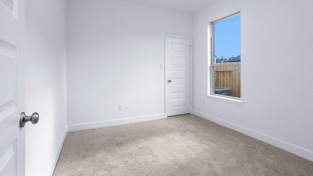 Spacious, unfurnished interior of a new home in Artavia 45', Conroe (Image 13).