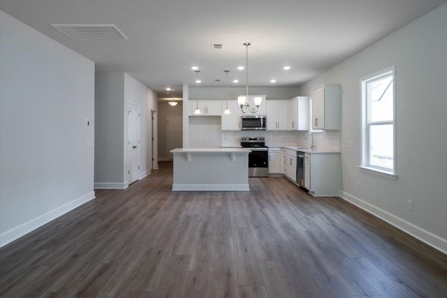 Café Area that opens to the Kitchen and gathering room. Model Café Area that opens to the Kitchen and gathering room. Model