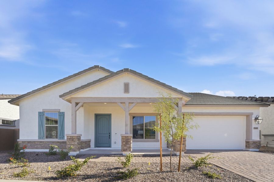 Front exterior of a new home in Legado, Queen Creek, AZ, highlighting curb appeal (Image 1). Front exterior of a new home in Legado, Queen Creek, AZ, highlighting curb appeal (Image 1).