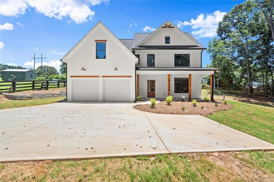 Front exterior of a new home in , Cumming, GA, highlighting curb appeal (Image 27). Front exterior of a new home in , Cumming, GA, highlighting curb appeal (Image 27).