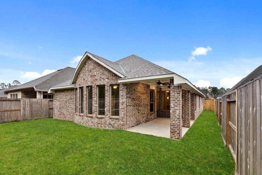 Exterior details and patio area of a home in The Highlands 45', Porter (Image 24).
