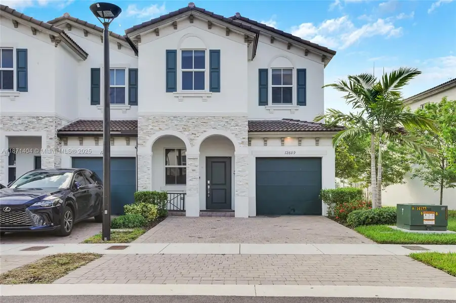 Front exterior of a new home in , Miami, FL, highlighting curb appeal (Image 1).