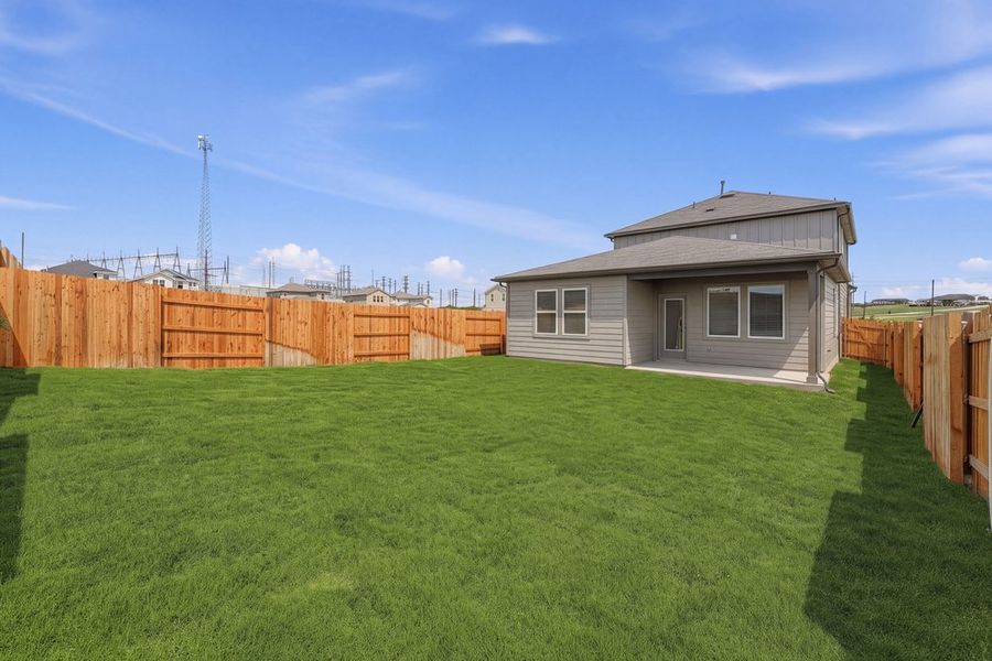 Exterior details and patio area of a home in Sunfield, Buda (Image 17).