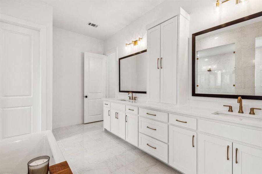 Main Bathroom featuring tile patterned flooring and dual bowl vanity