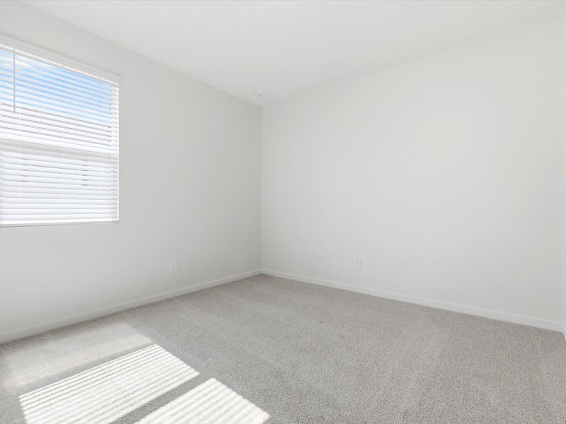Spacious, unfurnished interior of a new home in Blossom Rock Reserve Series, Apache Junction (Image 16).