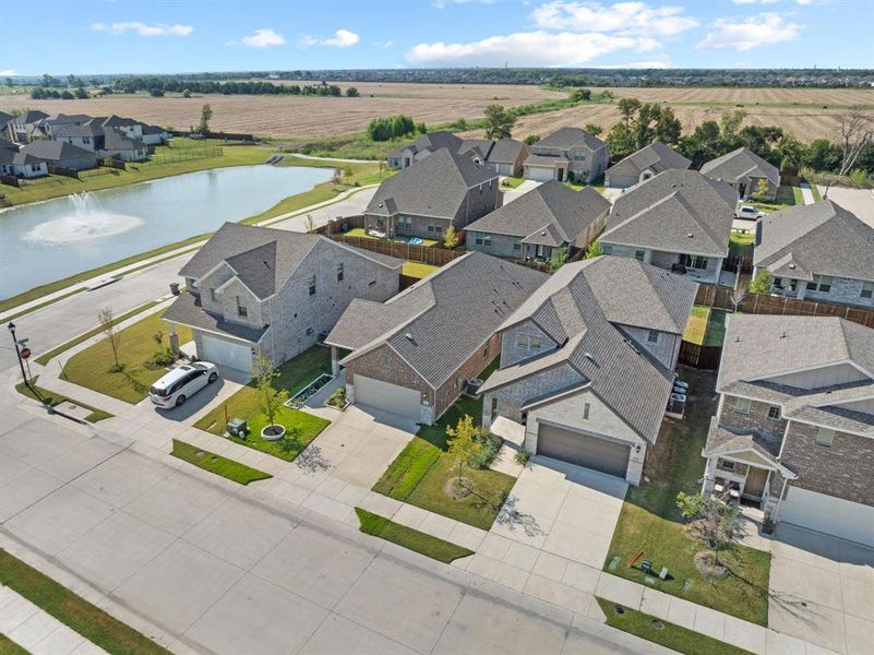Aerial perspective of suburban area featuring a large body of water Aerial perspective of suburban area featuring a large body of water