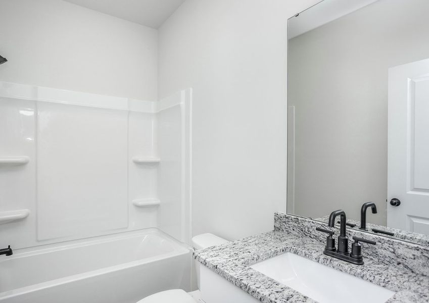 The secondary bathrooms are the perfect space for guests to get ready.
