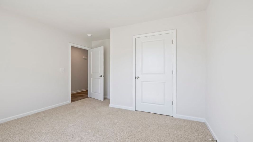 Spacious, unfurnished interior of a new home in Village Grove, Greenville (Image 13).