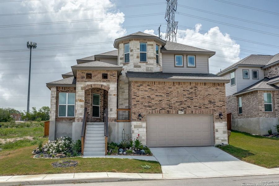 Front exterior of a new home in West Pointe Gardens, San Antonio, TX, highlighting curb appeal (Image 19). Front exterior of a new home in West Pointe Gardens, San Antonio, TX, highlighting curb appeal (Image 19).