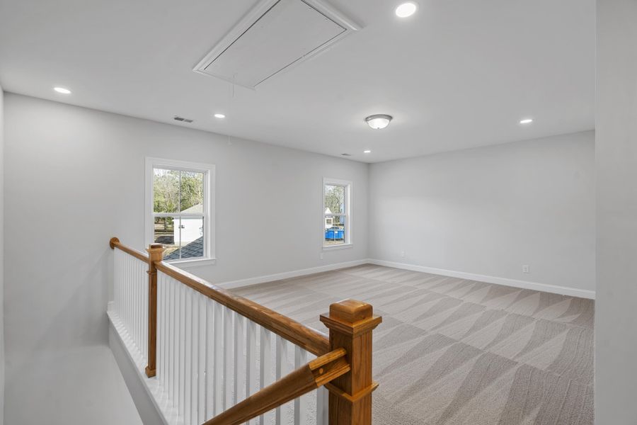 Spacious, unfurnished interior of a new home in K. Hovnanian's® Four Seasons at Lakes of Cane Bay, Summerville (Image 12).